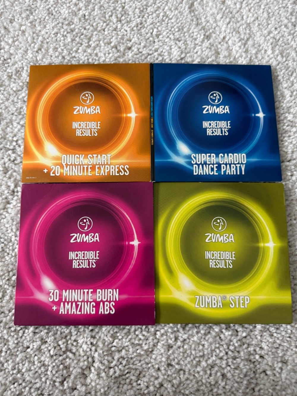 Zumba Fitness 4-Pack Workout DVD Set - Orange, Blue, Pink, Green